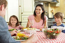 family eating meal together in kitchen