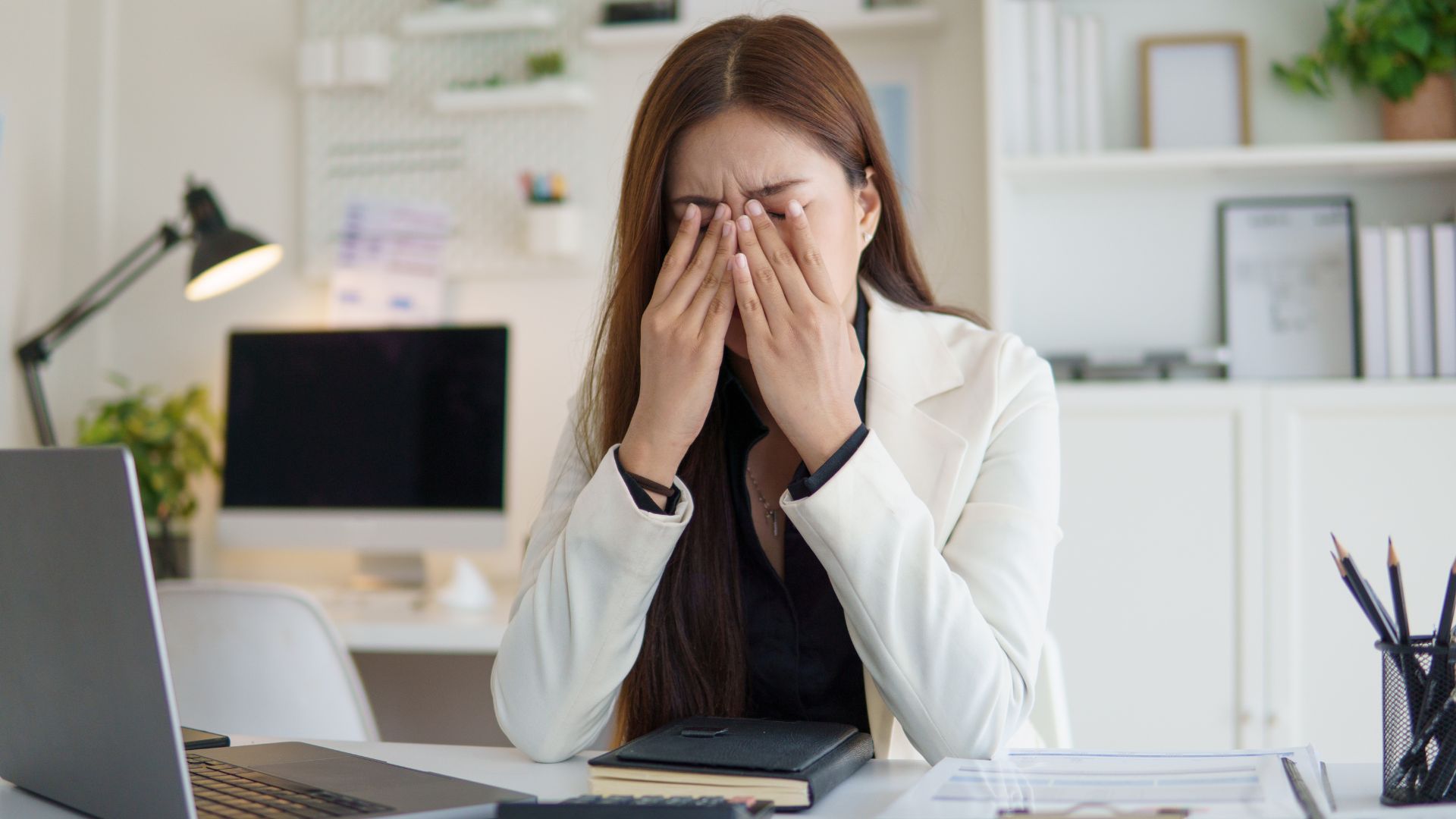 woman struggling with chronic fatigue at work