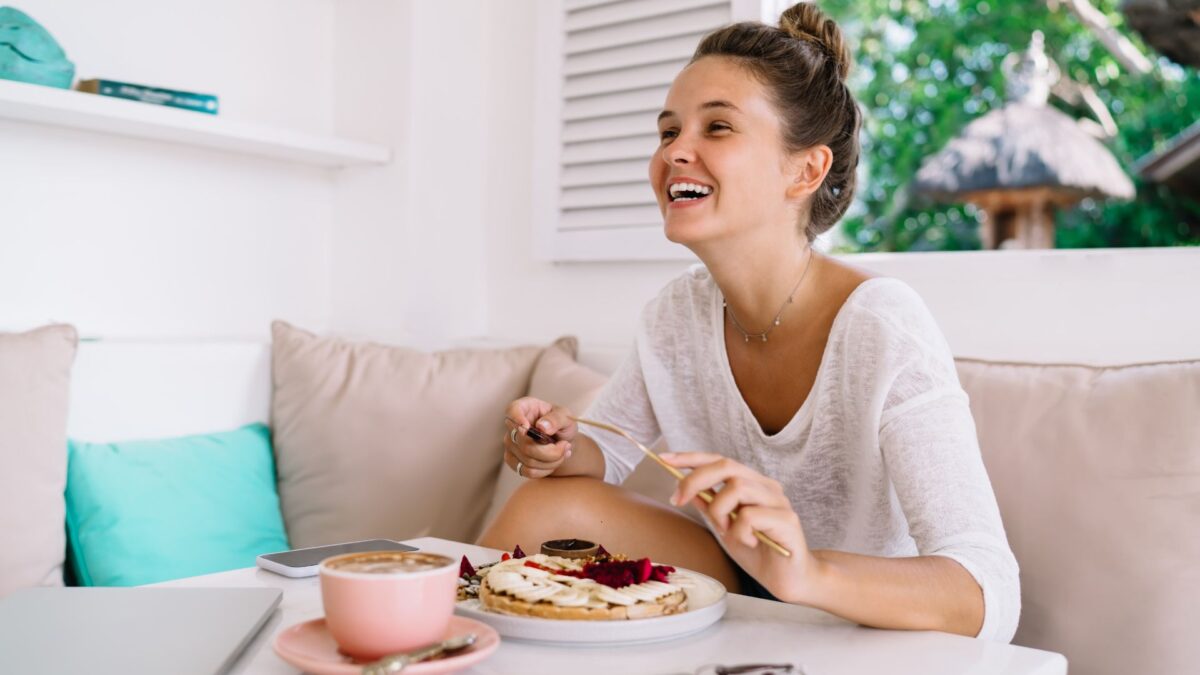 woman enjoying breakfast in the morning