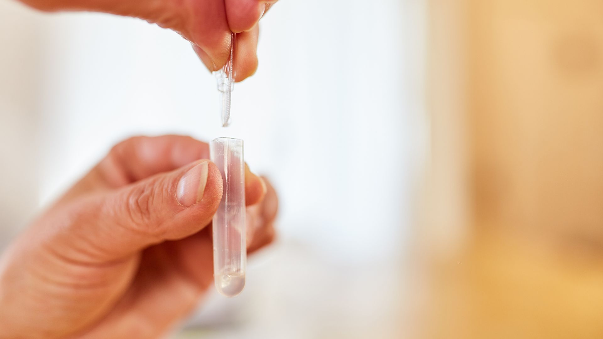 saliva testing with a pipette and tube